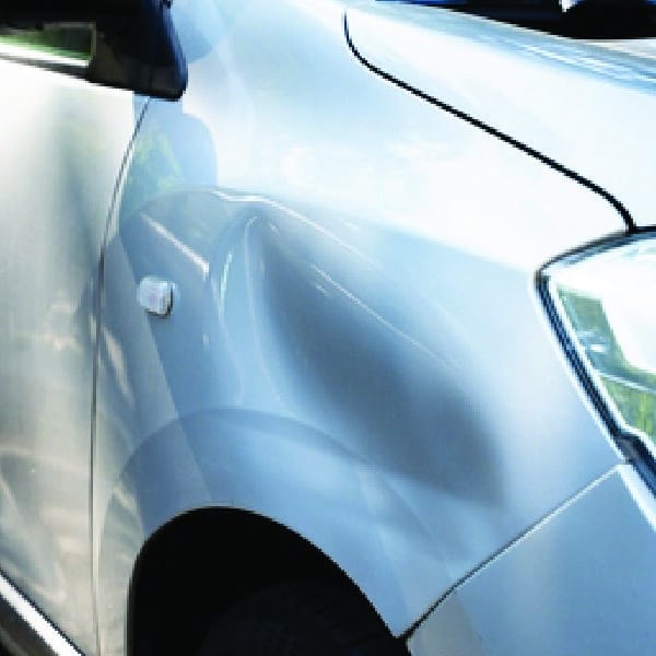 1/2 of part of a sliding image demonstrating a dent removed that can performed by TintBusiness for your USA car